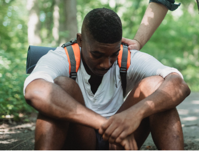 Man sitting sad on ground